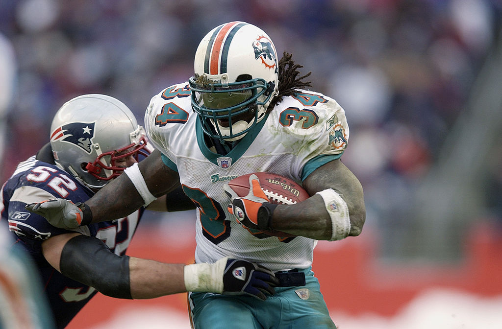 Miami Dolphisn running back Ricky Williams led the NFL in rushing during the 2002 season.