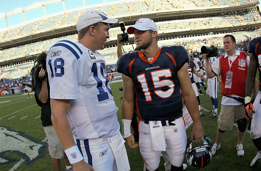 Peyton Manning for the Indianapolis Colts talks to Tim Tebow for the Denver Broncos. 