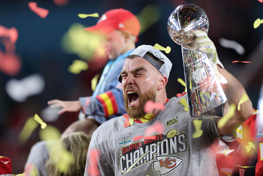 Travis Kelce of the Kansas City Chiefs celebrates with the Vince Lombardi Trophy after winning Super Bowl LIV