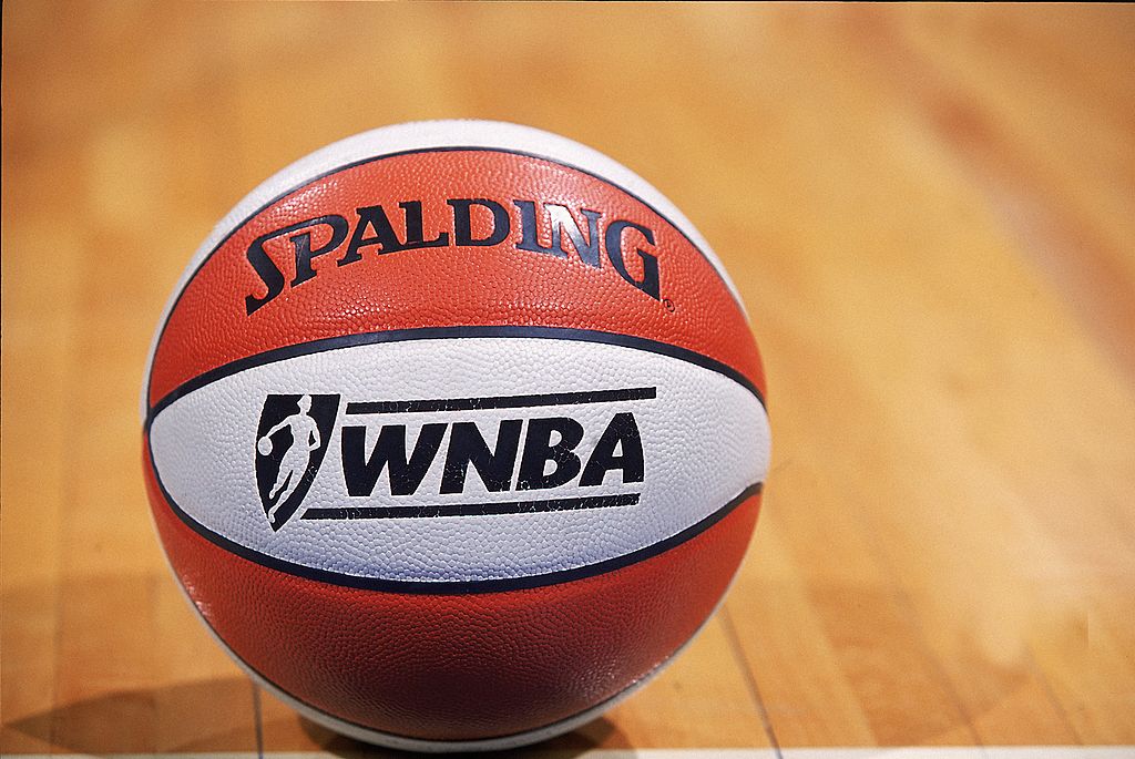 An official WNBA game ball on the court