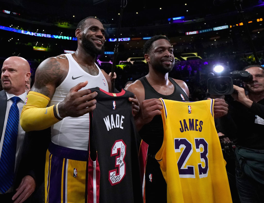 LeBron James and Dwyane Wade exchange jerseys.