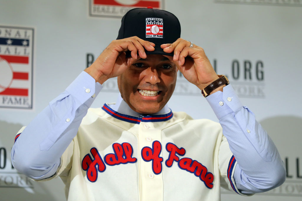 Mariano Rivera puts on his Hall of Fame cap during the 2019 Baseball Hall of Fame press conference
