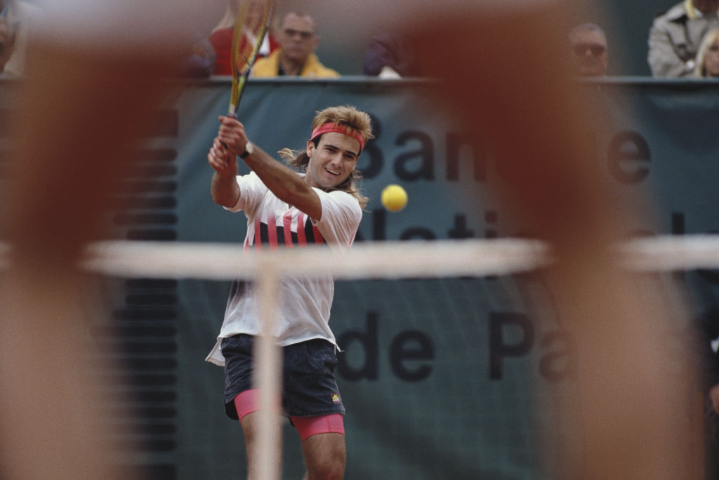 Andre Agassi hitting a tennis ball