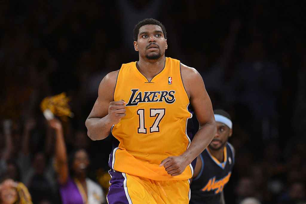 Andrew Bynum, the Los Angeles Lakers' first pick in the NBA draft and the  youngest player ever drafted, shows off his No. 17 jersey after he is  introduced at team headquarters in