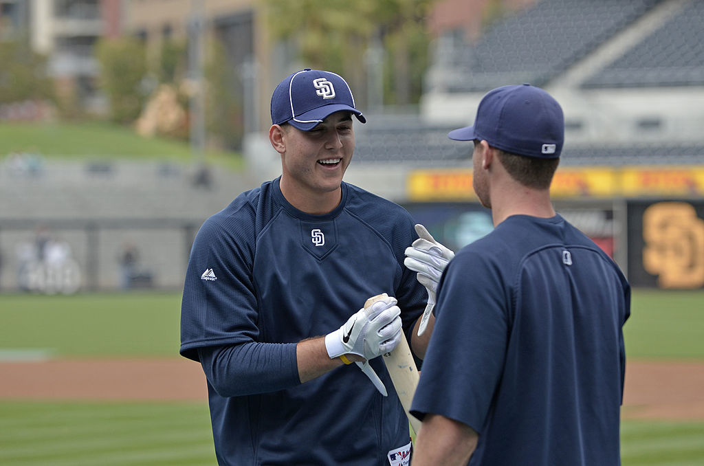 Anthony Rizzo of the San Diego Padres talks with a teammate