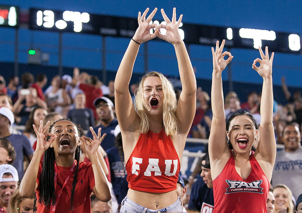 Florida Atlantic fans cheer during a football game. New FAU head coach Willie Taggart urged fans to "keep faith" during the coronavirus pandemic.