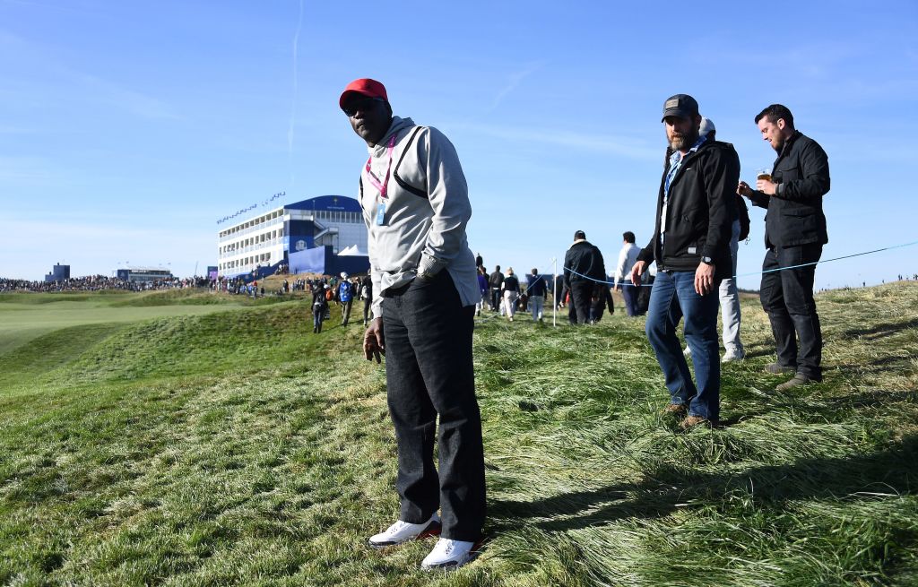 Former NBA player Michael Jordan watches Tiger Woods in 2018