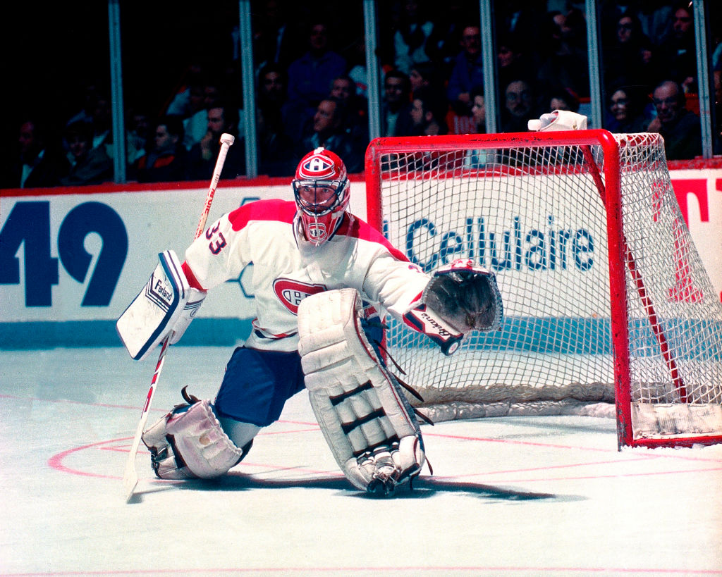 Former Montreal Canadiens goalie Patrick Roy, left, stands with