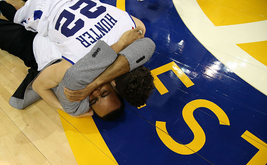 R.J. Hunter of the Georgia State Panthers celebrates with his father head coach Ron Hunter during 2015 March Madness