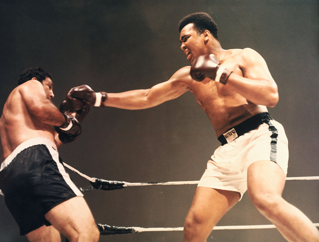 Heavyweight champions Muhammad Ali and Rocky Marciano boxing in composited film