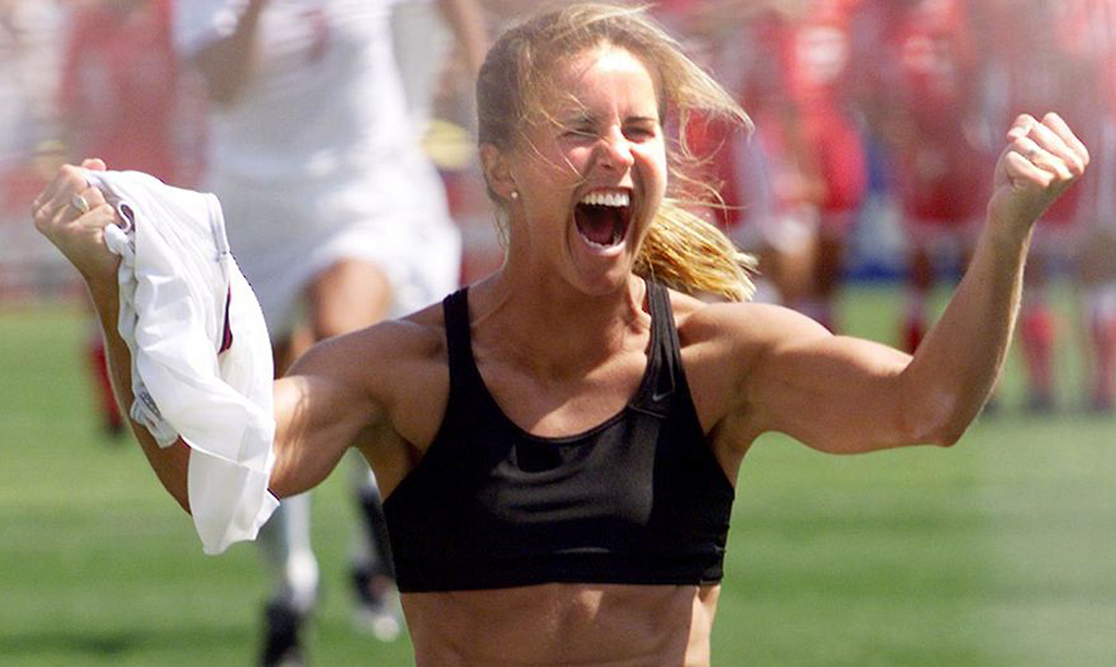 Brandi Chastain celebrates after scoring the winning goal in penalty kicks in the 1999 World Cup final against China. | HECTOR MATA/AFP via Getty Images