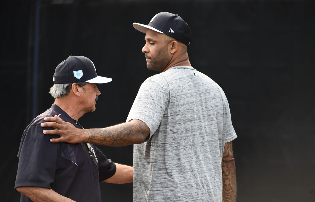 Yankees pitcher C.C. Sabathia speaks with instructor Ron Guidry in 2019