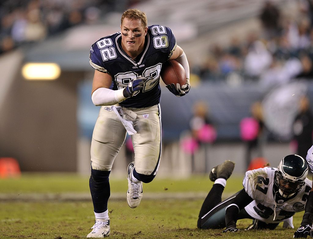 Jason Witten running with the ball without his helmet on