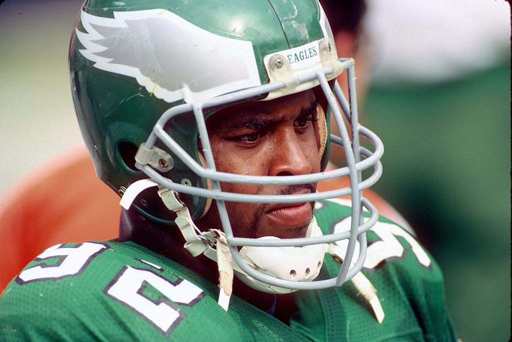 Defensive lineman Reggie White of the Philadelphia Eagles looks on from the sideline