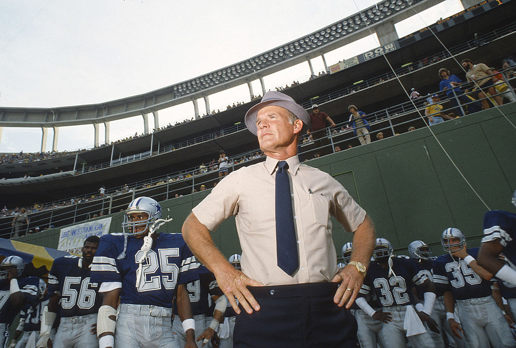 Head coach Tom Landry of the Dallas Cowboys stands with his team
