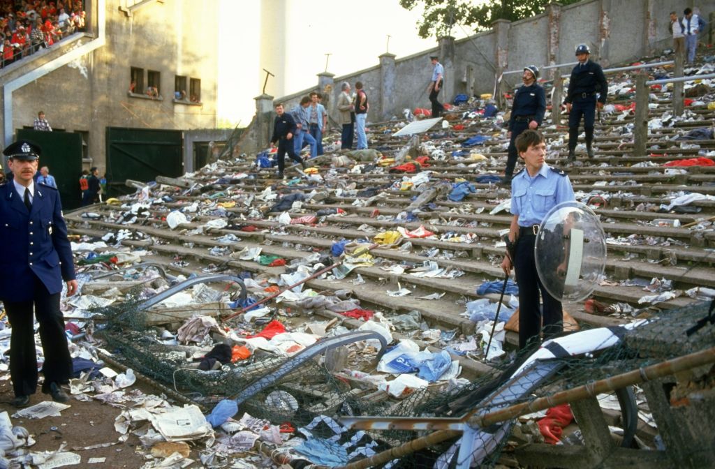 Workers clear the debris at Heysel Stadium after the European Cup final. | David  Cannon/Allsport/Getty Images