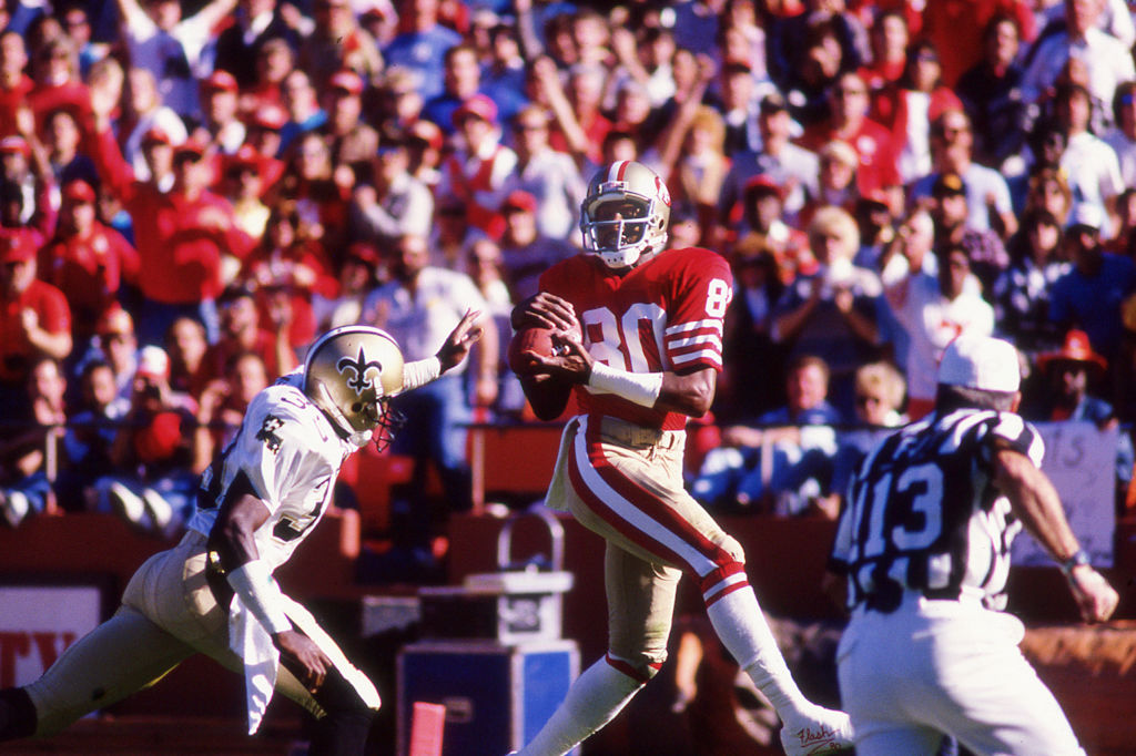 Hall of Famer Jerry Rice catches a pass to score a touchdown
