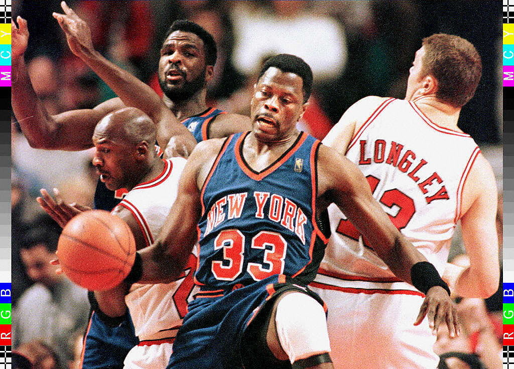 New York Knicks center Patrick Ewing holds back Chicago Bulls guard Michael Jordan