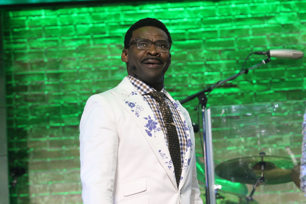 Hall of Famer Michael Irvin walks across the stage during a speech