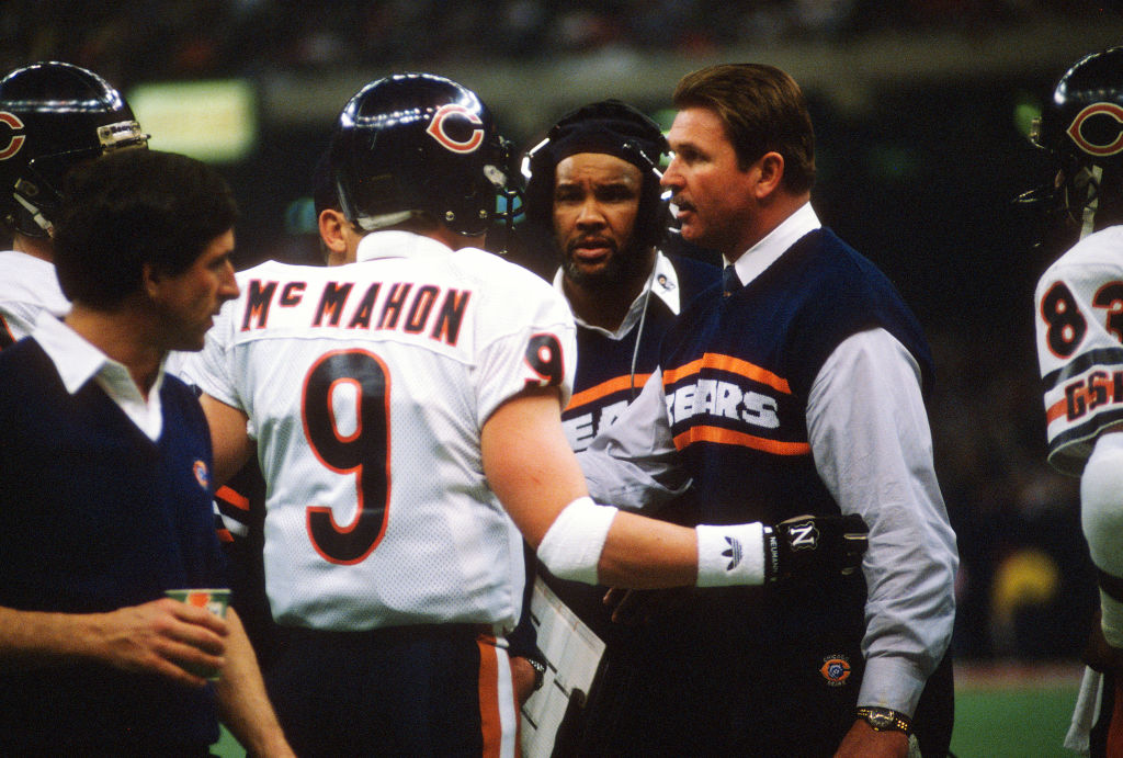 Head Coach Mike Ditka of the Chicago Bears talks with his quarterback Jim McMahon in 1986