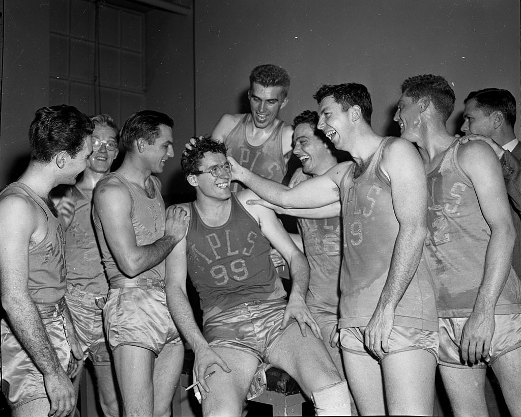 Minnneapolis Lakers teammates congratulate George Milken after a game
