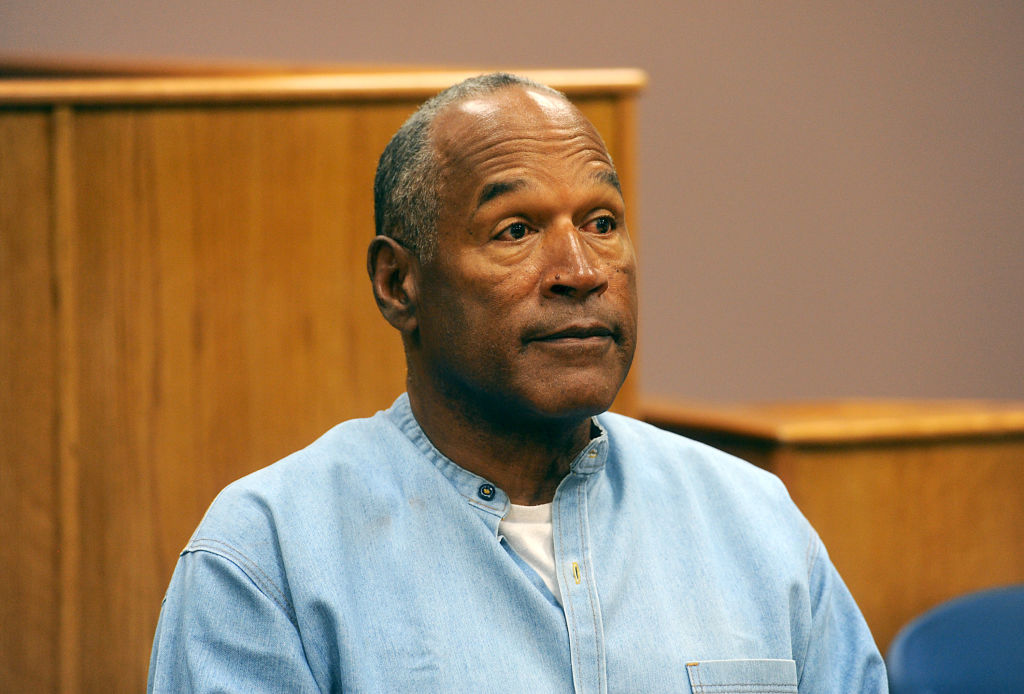 O.J. Simpson's net worth has diminish since his 2017 parole hearing, where he speaks to the judge in this photo.