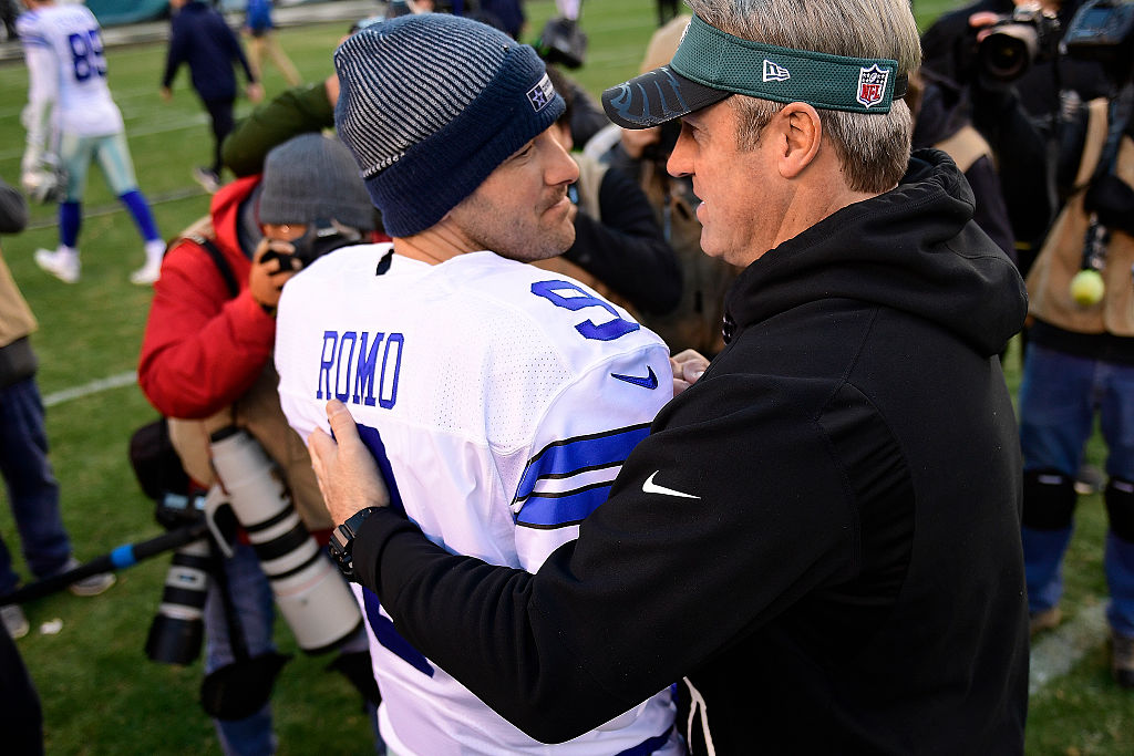 Tony Romo of the Dallas Cowboys is greeted by Doug Pederson, head coach of the Eagles in 2015