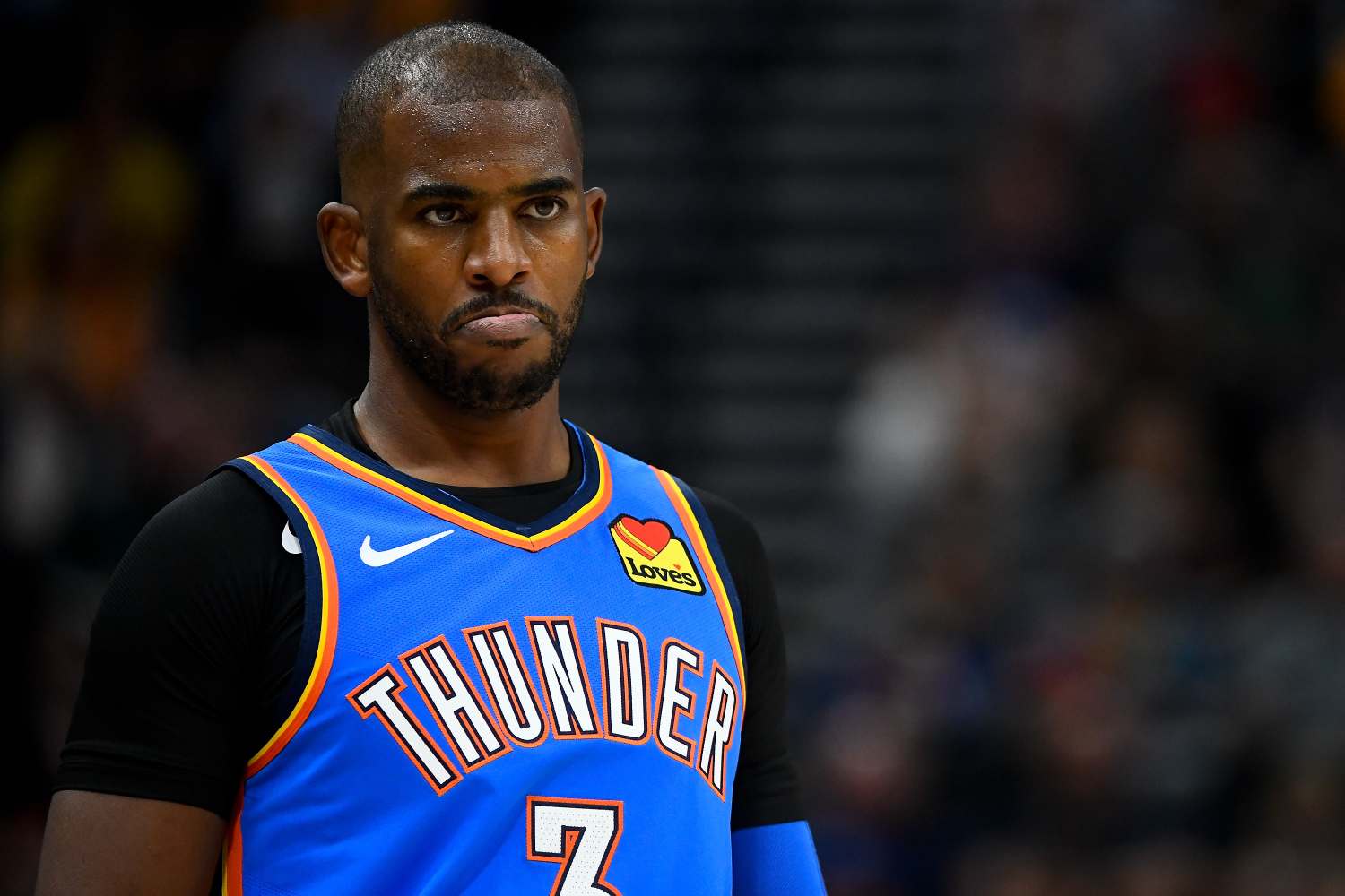 Chris Paul looks on during a Thunder game
