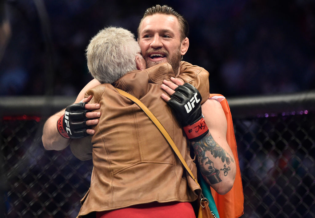 Jerry Cerrone hugs Conor McGregor of Ireland during the UFC 246 event
