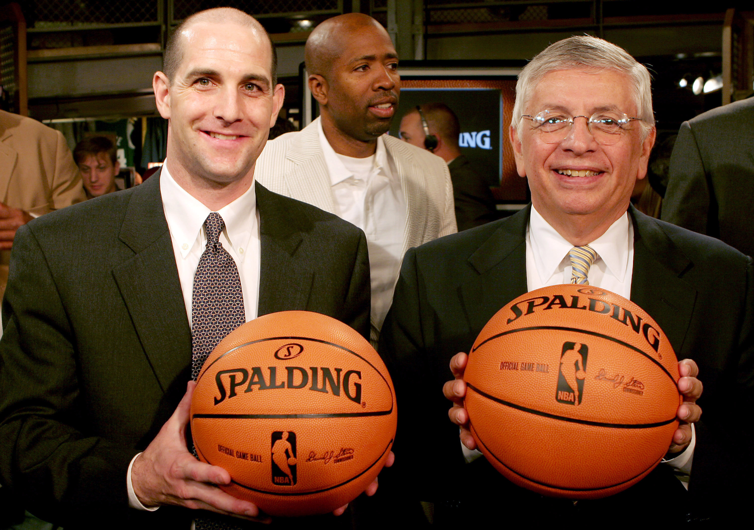 David Stern posing with the NBA ball that he introduced