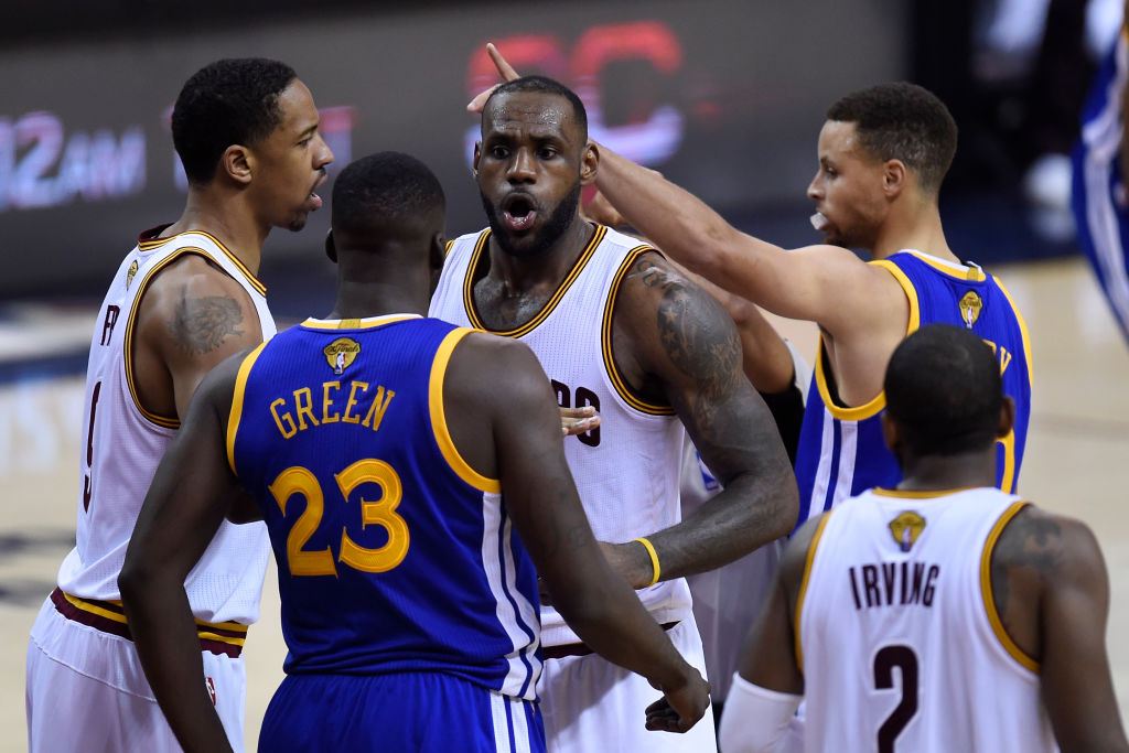 The Cavaliers' LeBron James exchanges words with the Warriors' Draymond Green