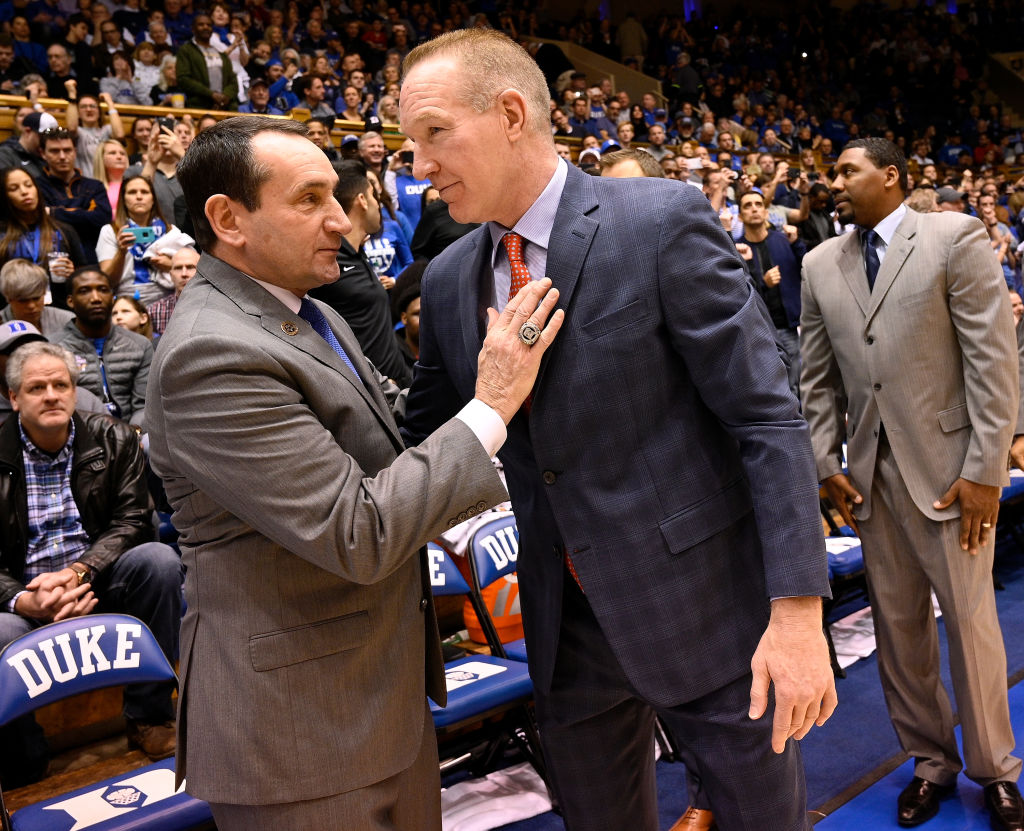 Head coach Mike Krzyzewski of the Duke Blue Devils and head coach Chris Mullin of the St. John's Red Storm greet each other