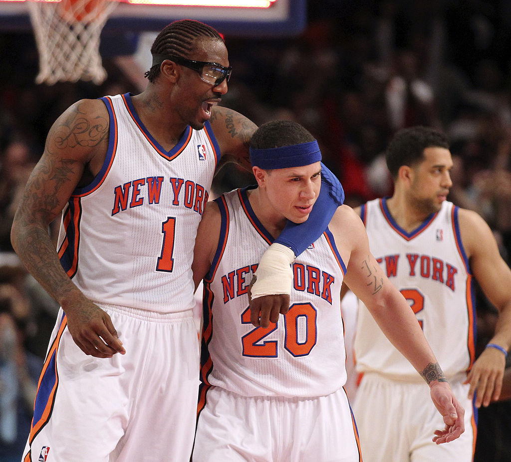 The Knicks' Amare' Stoudemire grabs Mike Bibby