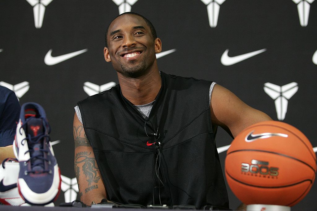Kobe Bryant smiling at a Lakers press confrence