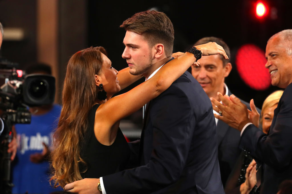 Luka Doncic reacts after being drafted third overall