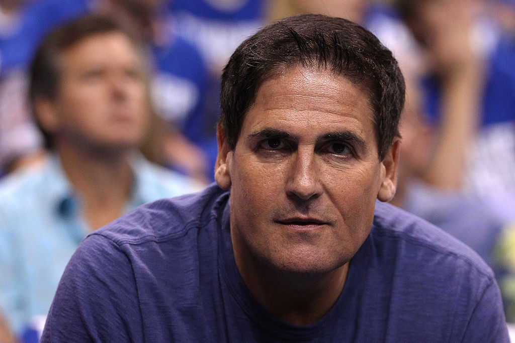 Mark Cuban looks on from the bench during a game