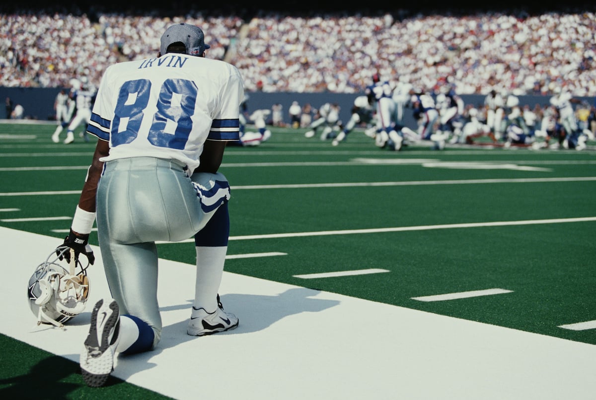 Michael Irvin watches the Dallas Cowboys and New York Giants from the sidelines.