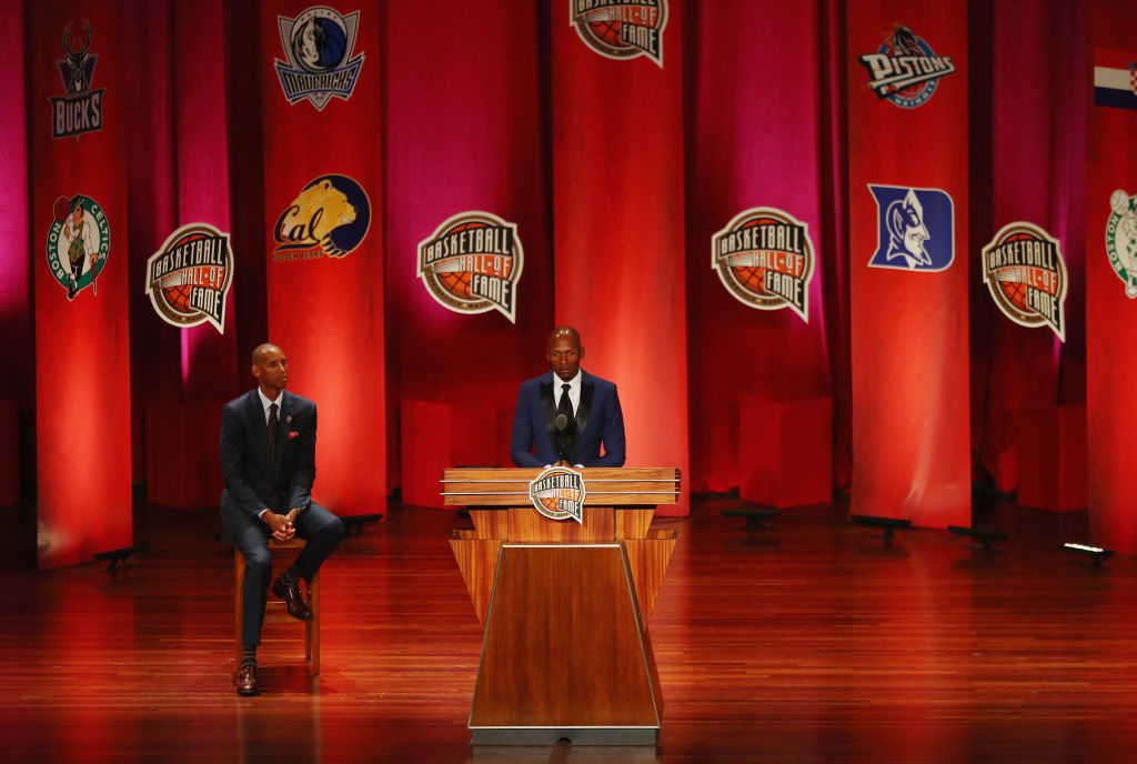 Enshrinee Ray Allen speaks as Reggie Miller looks on during the 2018 Basketball Hall of Fame Enshrinement Ceremony