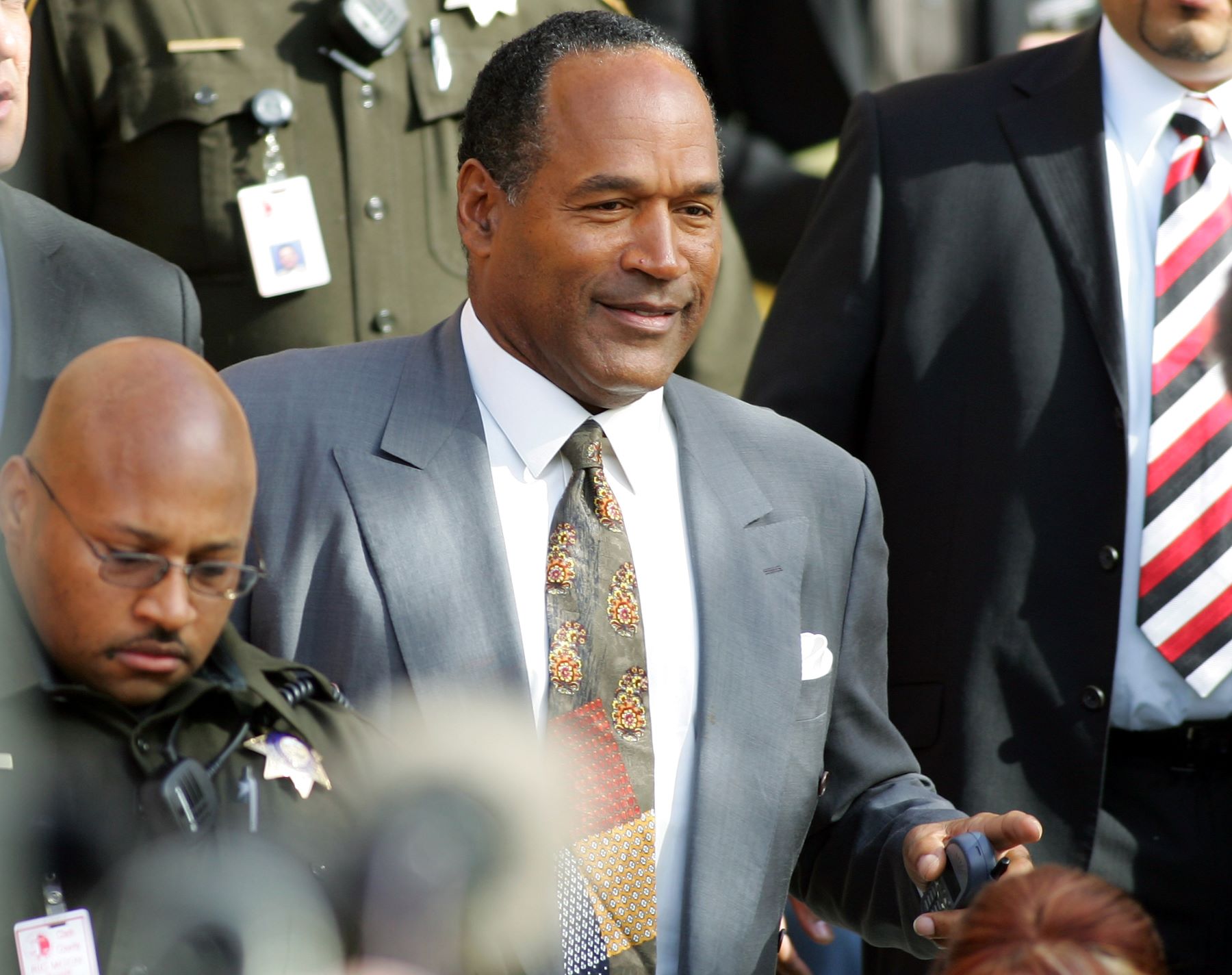 O.J. Simpson leaving Las Vegas Court before prison sentencing for burglary, robbery, and assault charges