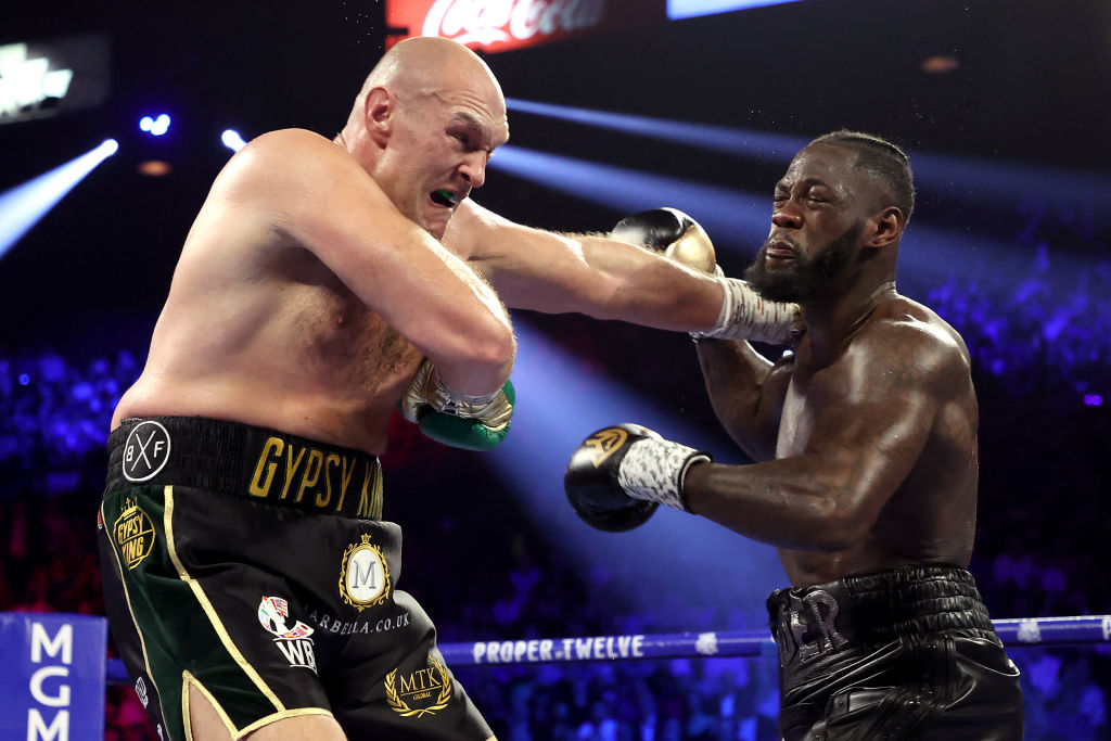Tyson Fury and Deontay Wilder exchange punches