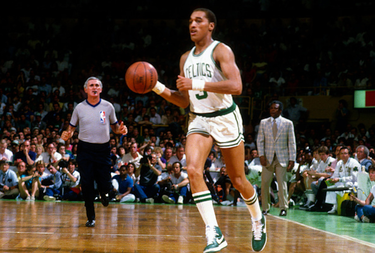 Referee Earl Strom follows Dennis Johnson of the Boston Celtics up the floor during a 1984 basketball game against the Los Angeles Lakers