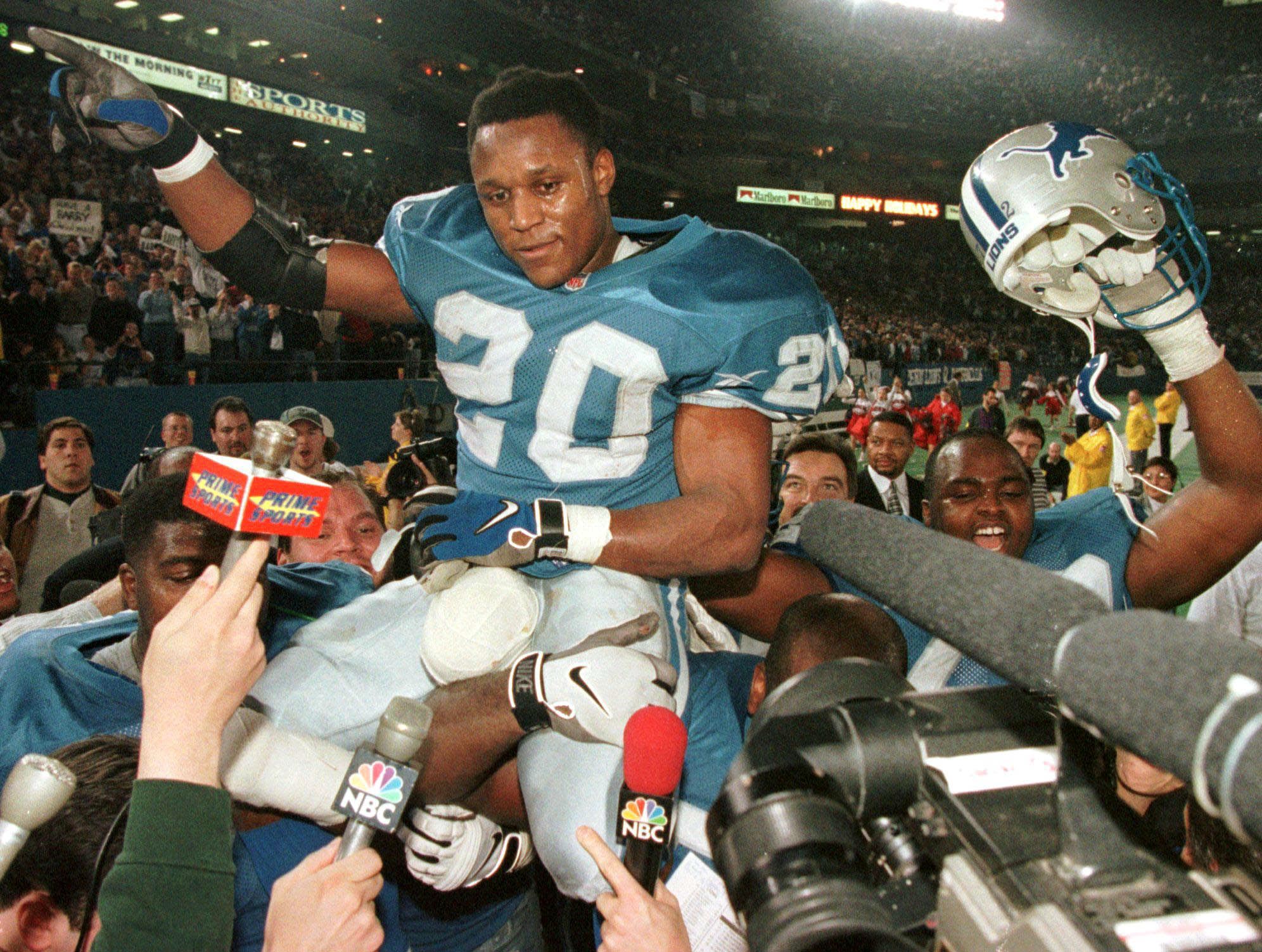 Barry Sanders getting carried off the field