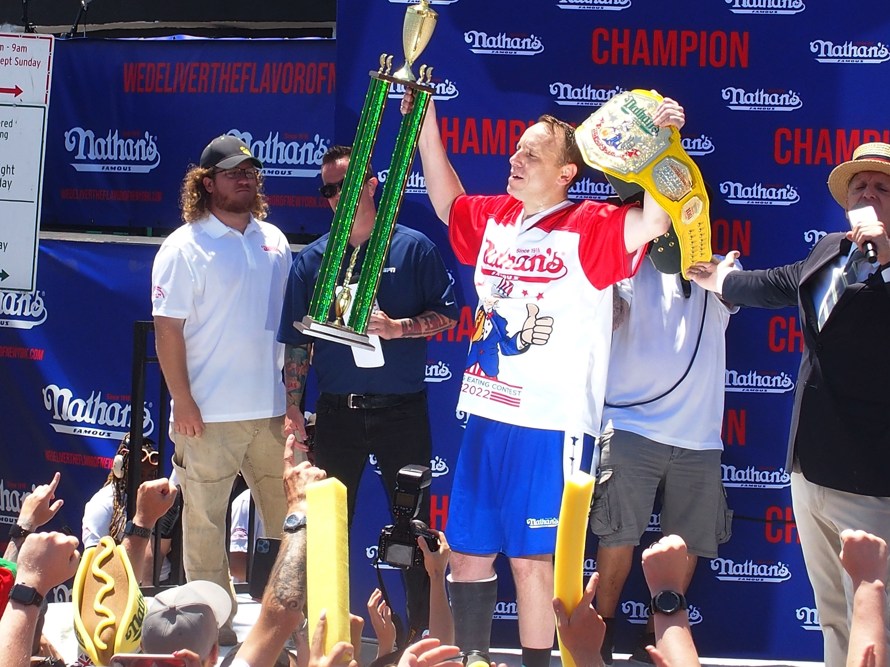 Competitive eater Joey Chestnut wins with 63 hot dogs in the men's division at the 2022 Nathan's Famous International Hot Dog Eating Contest.