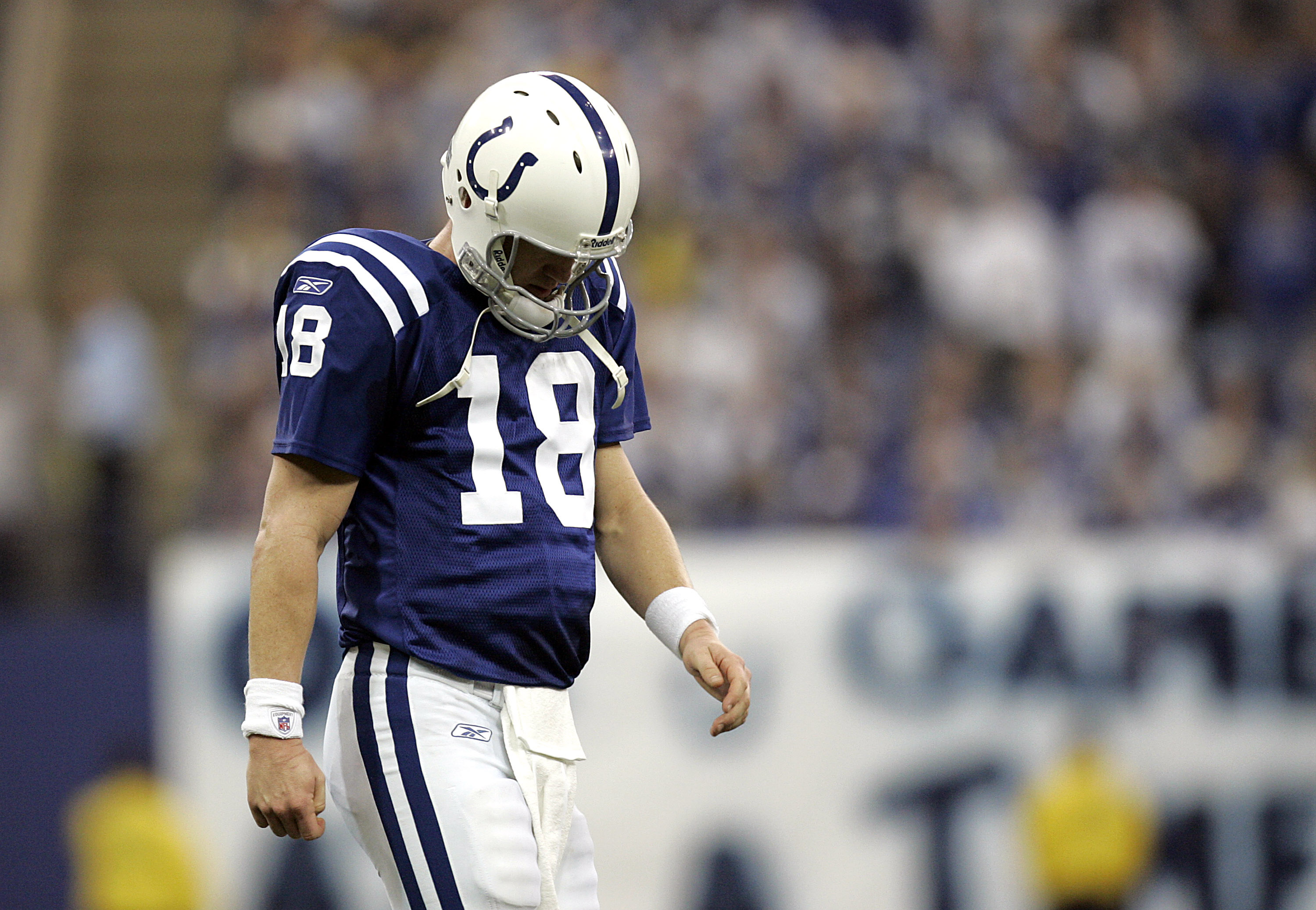Peyton Manning walking off the field after a Colts loss