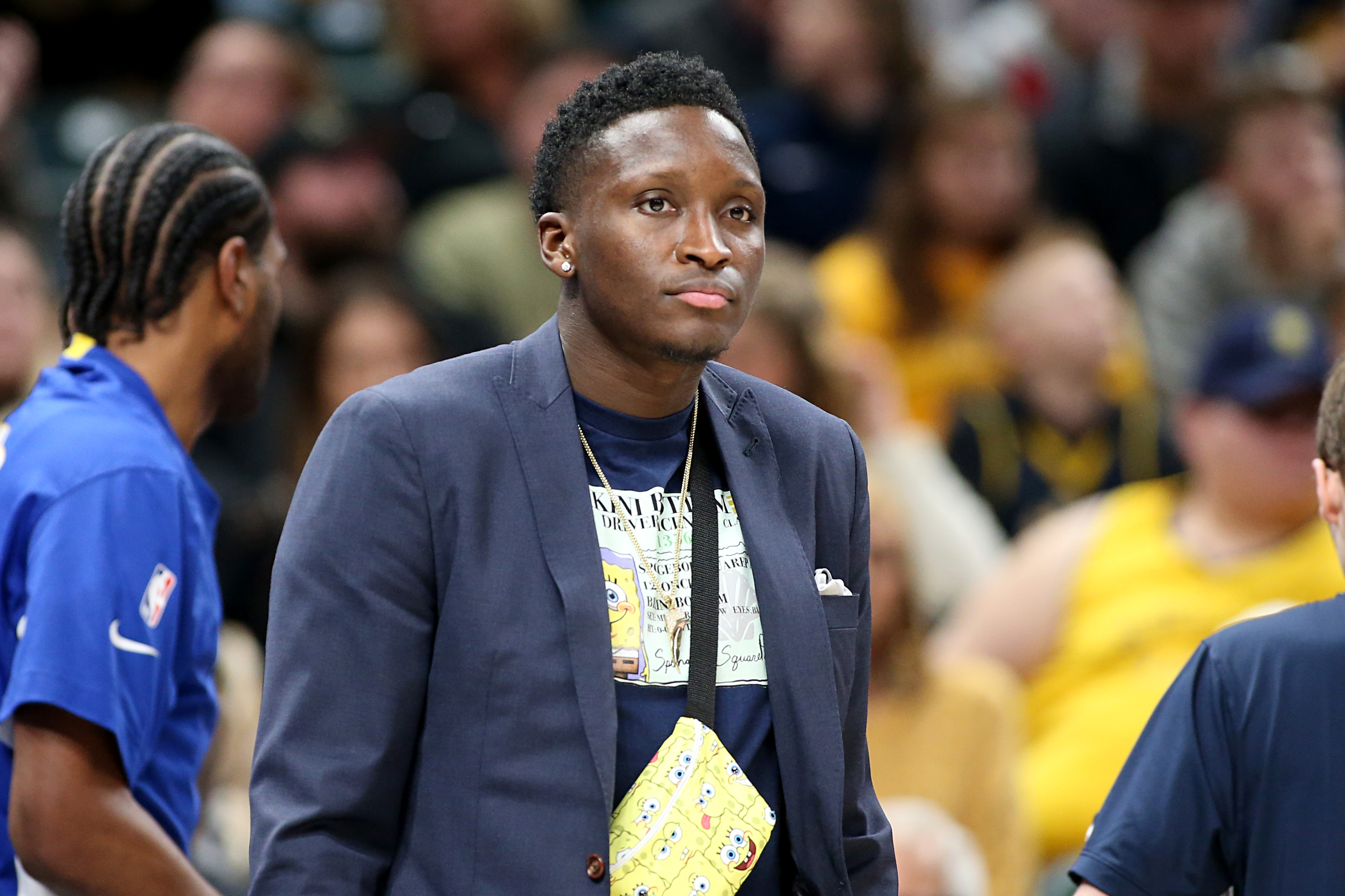 Victor Oladipo watching a Pacers game from the sidelines