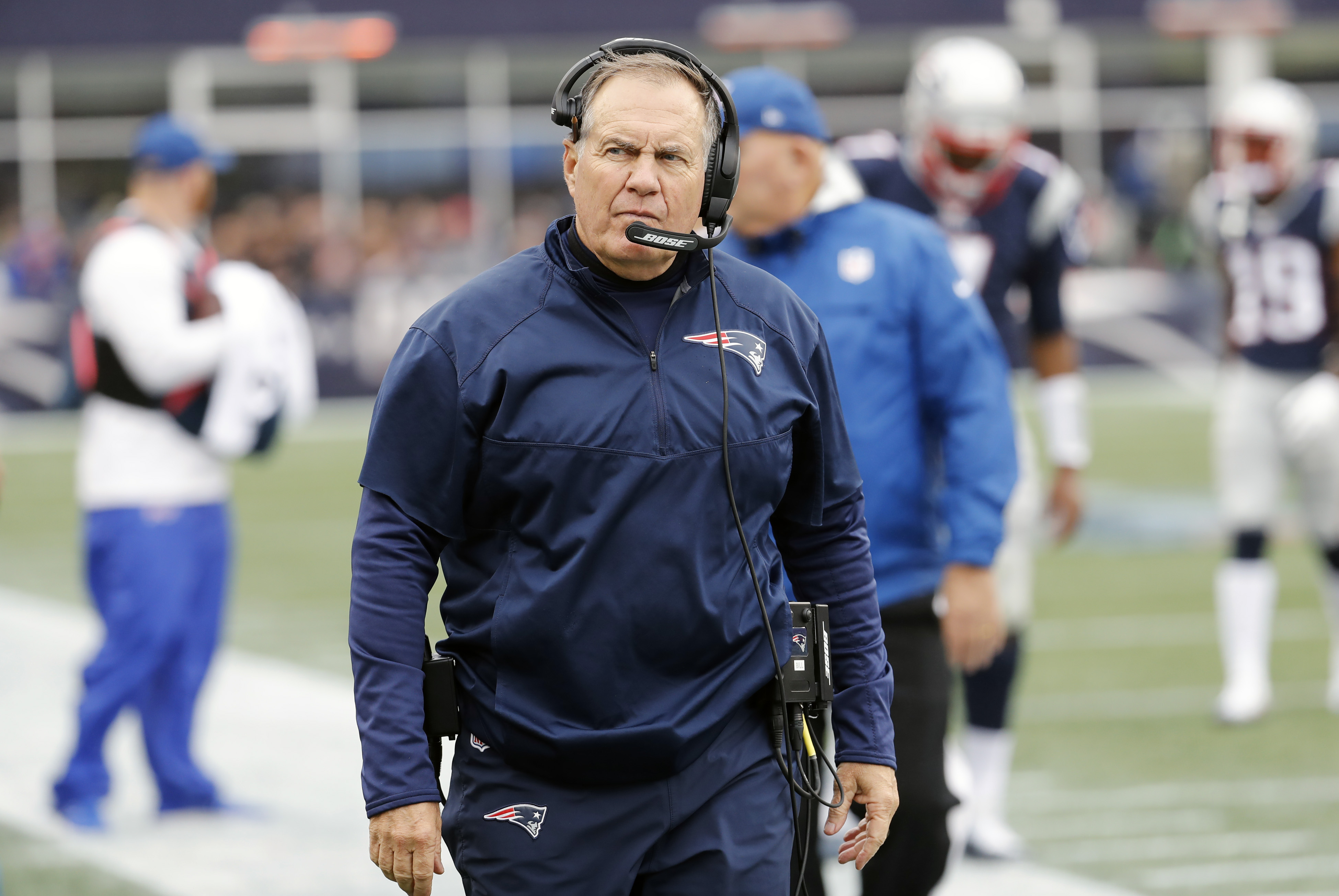 Bill Belichick scowls on the sideline during a game