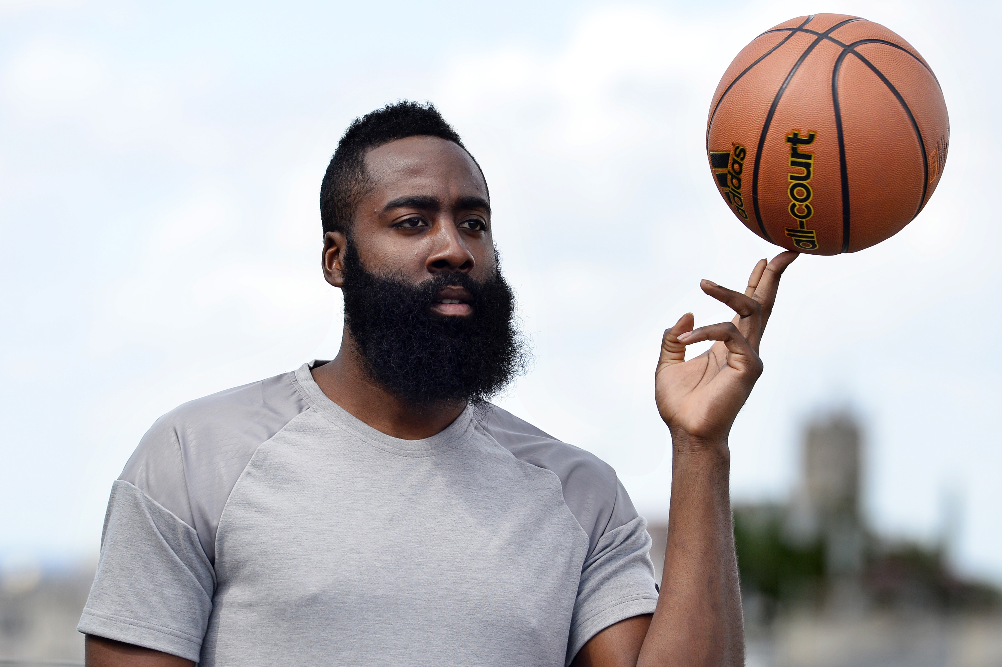 James Harden spins a ball on his finger for a photo shoot
