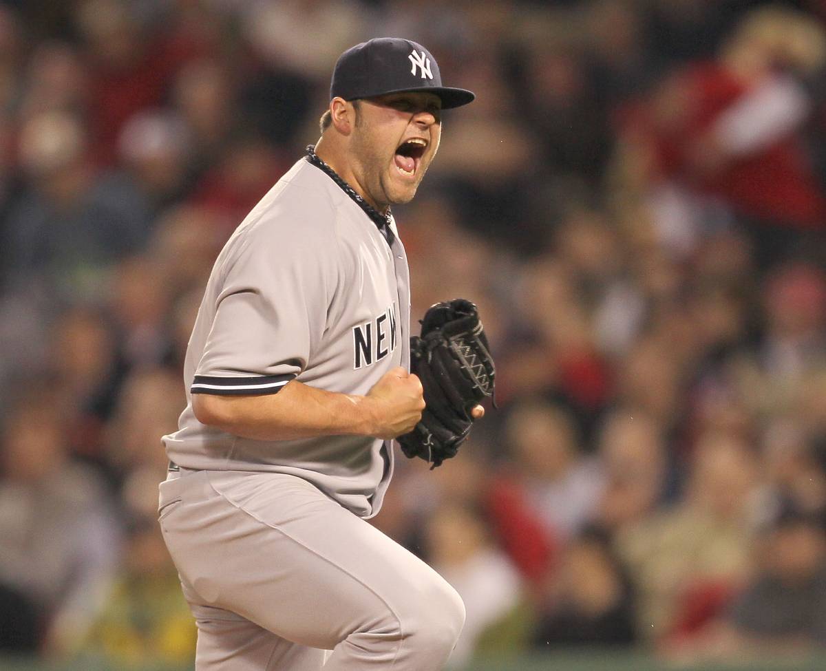 Yankees player Joba Chamberlain does a fist pump after winning a World Series title in 2009.