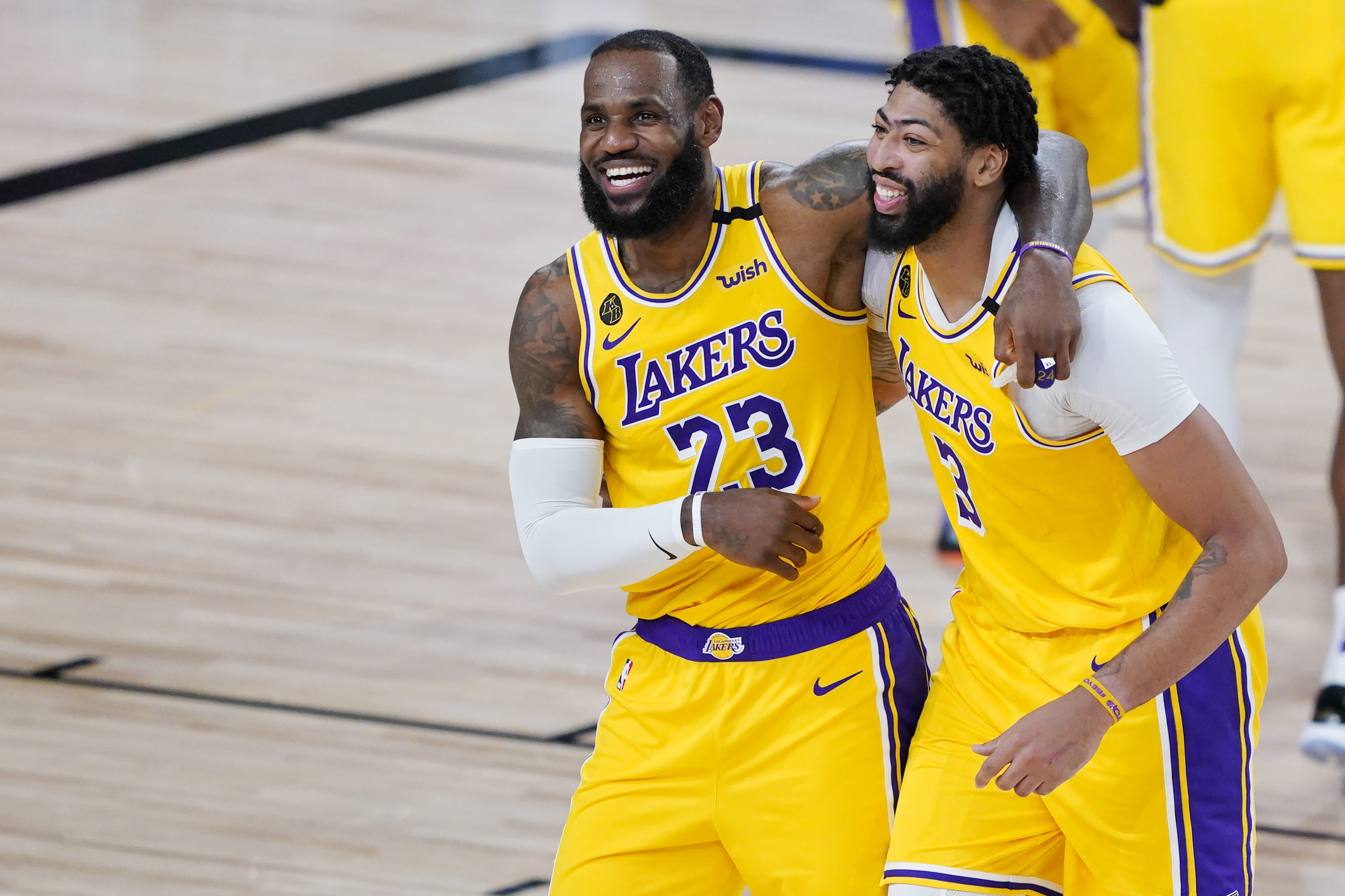 LeBron James and Anthony Davis celebrate after winning a game