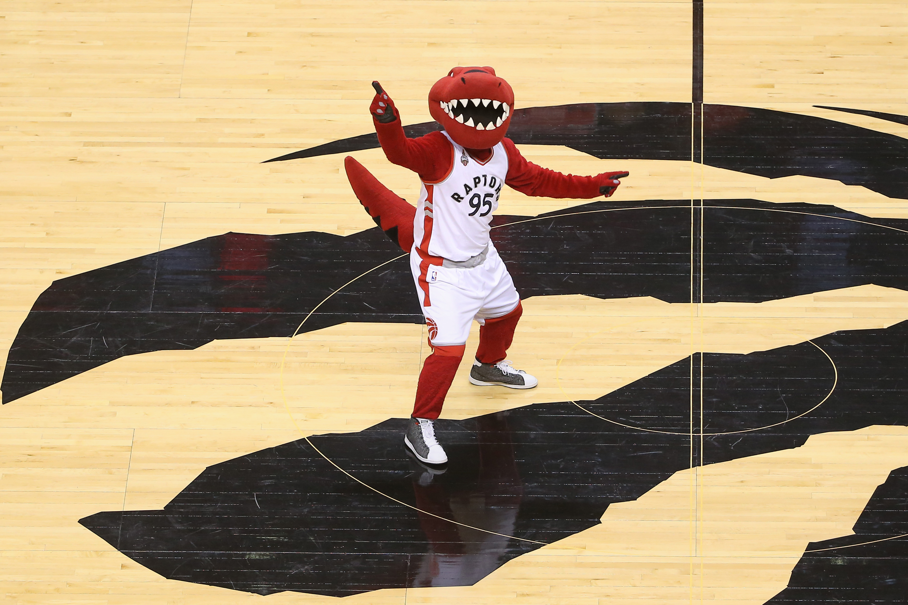 The Toronto Raptors NBA mascot standing on the court before a game